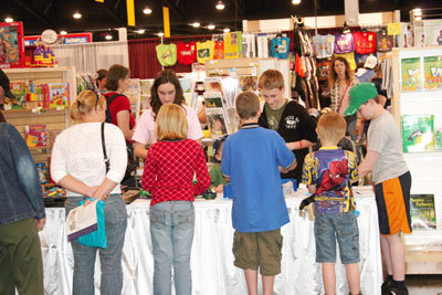 Conference attendees enjoying a hands-on experience at our play table. Conference attendees enjoying a hands-on experience at our play table.